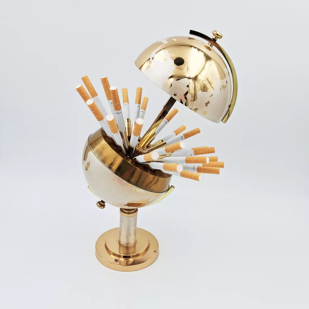 Vintage cigarettes dispenser shape of an earth globe