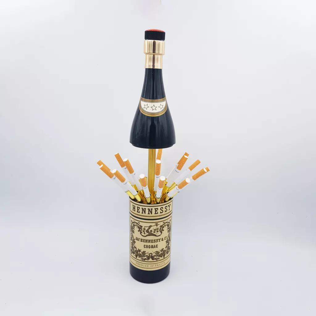 Vintage cigarettes dispenser shape of a bottle of cognac Hennessy musical box