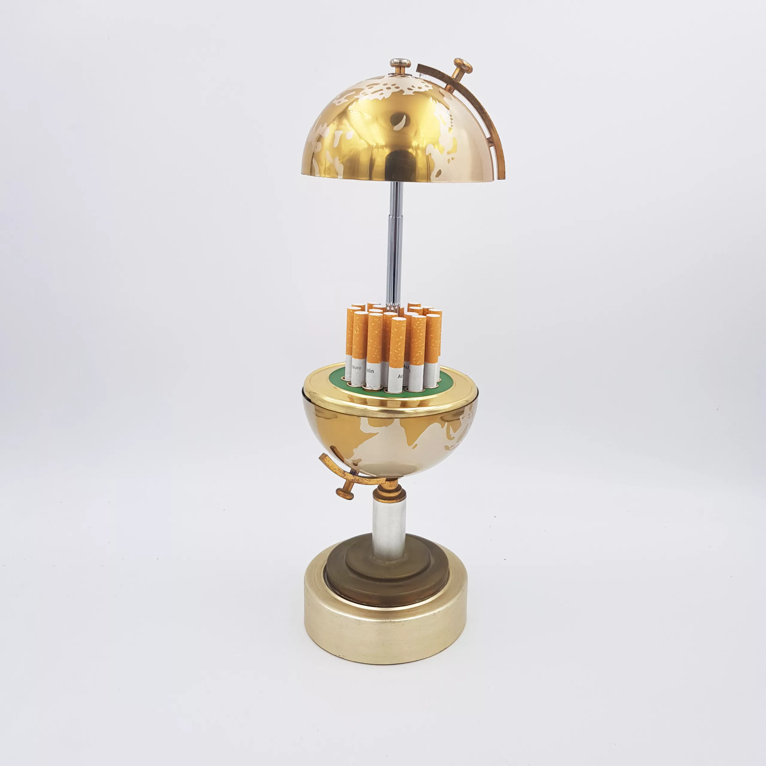 Vintage cigarettes dispenser shape of a small earth globe