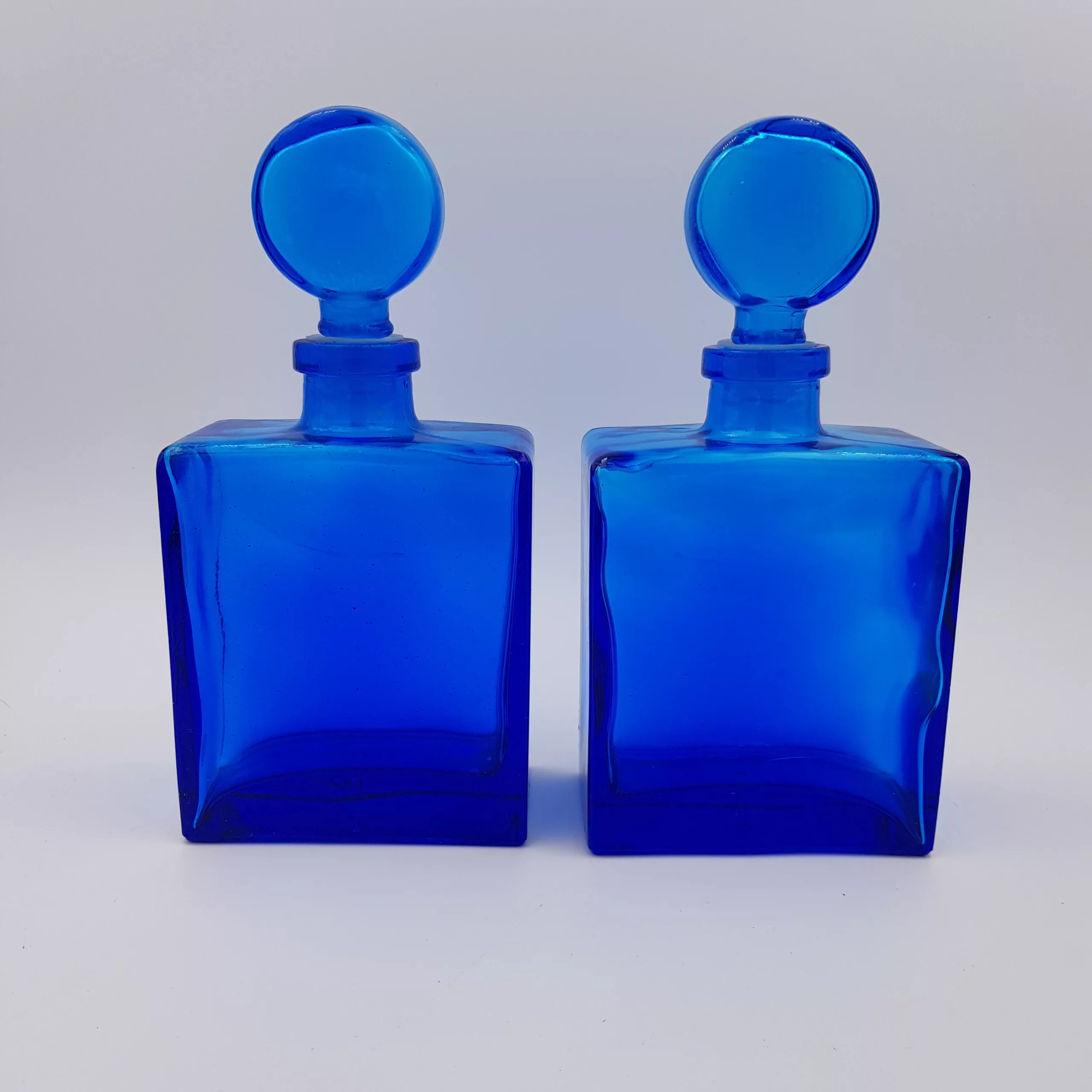 2 vintage cobalt blue glass flasks