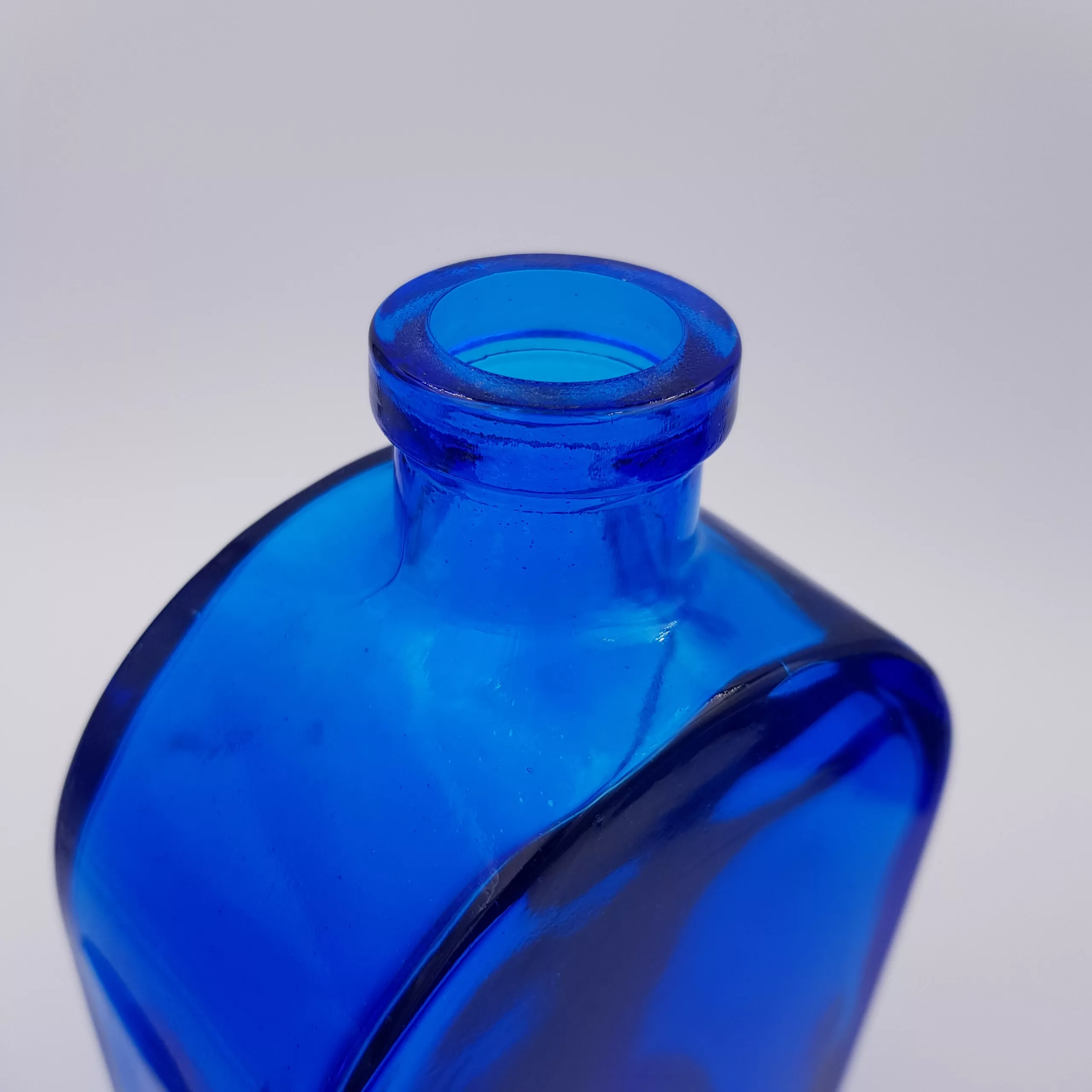 2 vintage cobalt blue glass flasks round shoulders