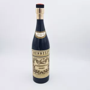 Vintage cigarettes dispenser shape of a bottle of cognac Hennessy musical box