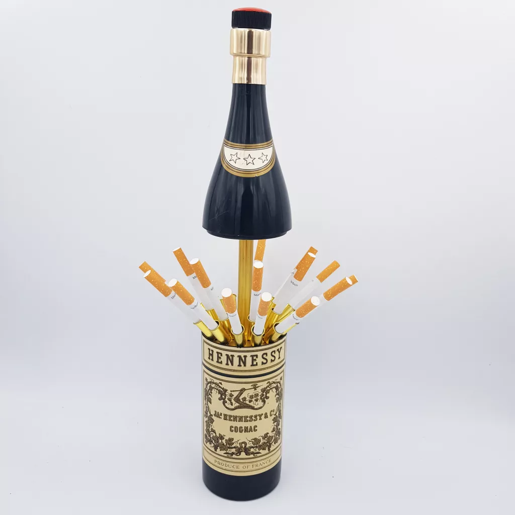 Vintage cigarettes dispenser shape of a bottle of cognac Hennessy musical box Vintage cigarettes dispenser shape of a bottle of cognac Hennessy musical box