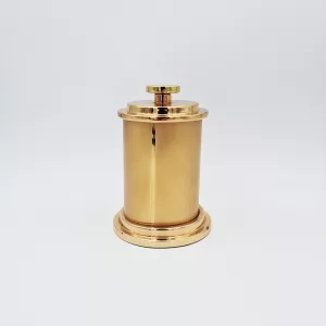Vintage cigarettes dispenser shape of a gold cylinder